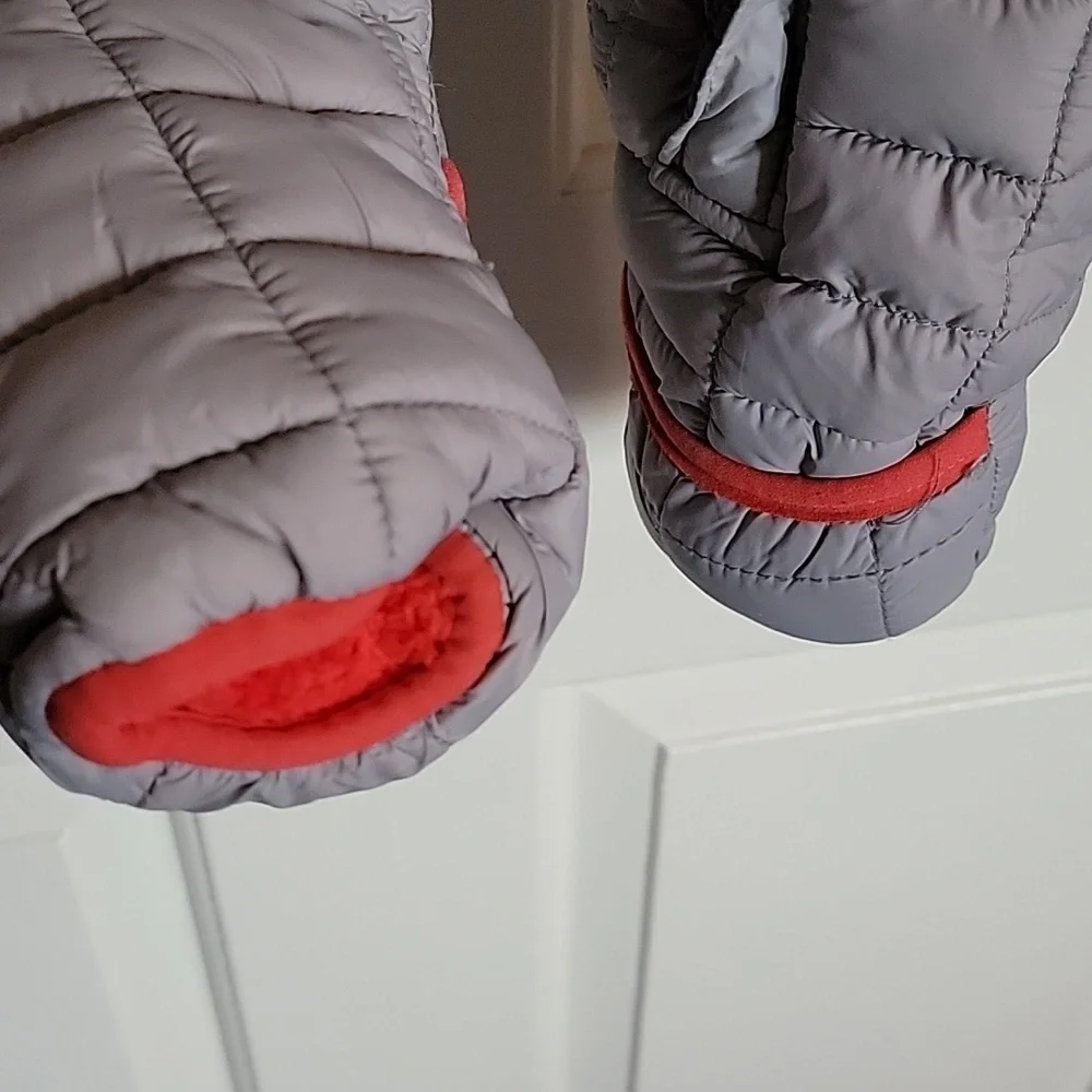 Snozu infant snowsuit, 3-6 months. Different shades of gray with orange lining.